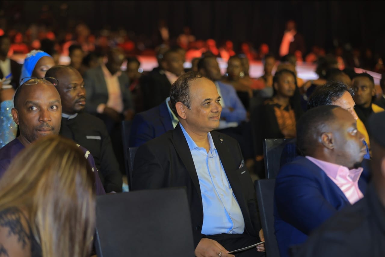 Sponsors and VIP guests seated in the audience at an evening event
